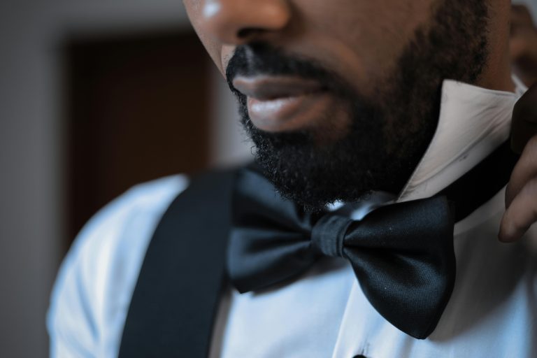 A closeup of a bearded groom after they have tidied themselves up.